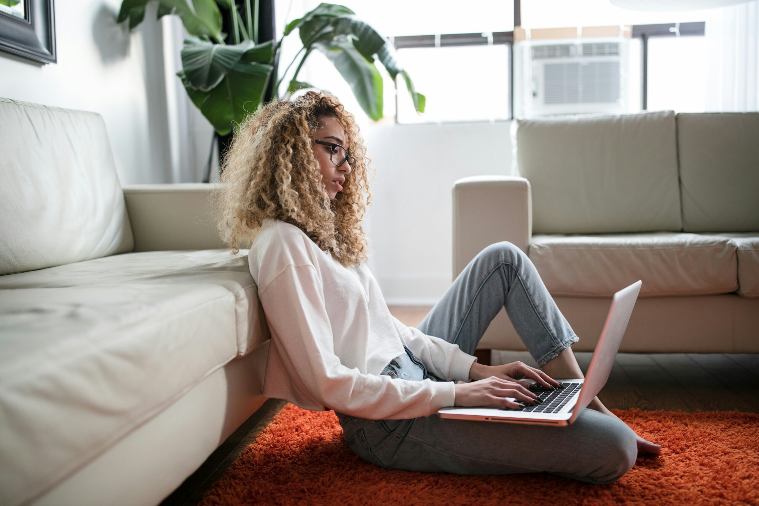Woman on computer researching load flexibility program